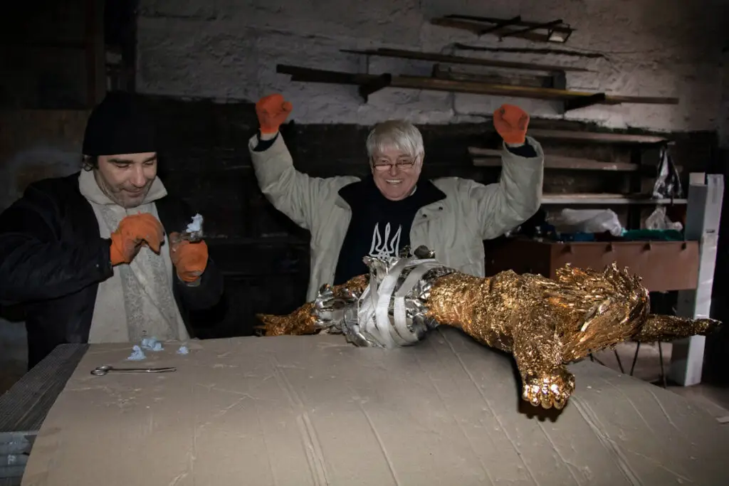 The Art of MFF | "The Cross of Peace" project featuring the Golden Crucifixion. | Final assembly of the Golden Crucifixion. Sergey Melnikoff (right) and Viktor Bielchyk reflect with pride on the result of six months of painstaking work. Odesa, 2024.
