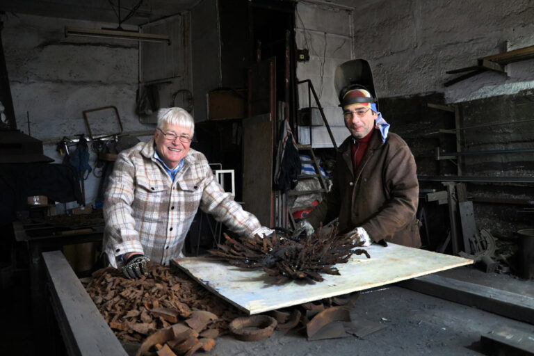 Artist Sergey Melnikoff (left) and welder Viktor Bielchyk working on the sculpture "Ukrainian Phoenix" in their Odesa workshop. 2023.