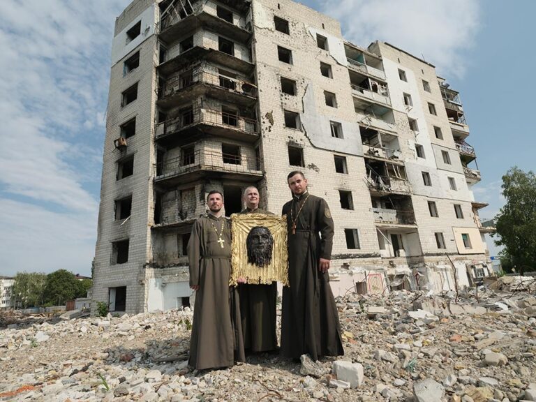 The Art of MFF | Chaplains Andriy Yaniv, Yurii Parfaniuk, and Roman Khorbutii with the iron icon "The Holy Mandylion" in Borodianka.