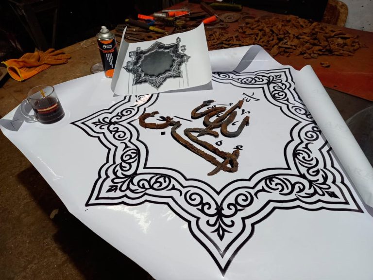 Allah al-Akbar (“Allah is Great”) by Sergey Melnikoff, a.k.a. MFF. Calligraphic structure composed of authentic wartime fragments collected at sites of battle.