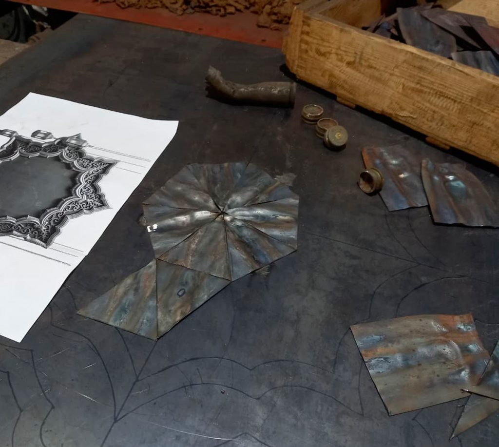 The wavy ‘fabric’ of the central section is composed of processed metal fragments.