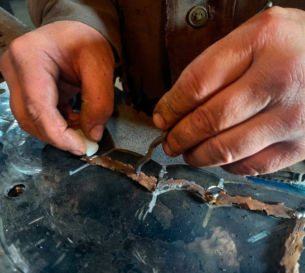 The outer frame is assembled using the same technique, built centimetre by centimetre from many hundreds of war fragments.