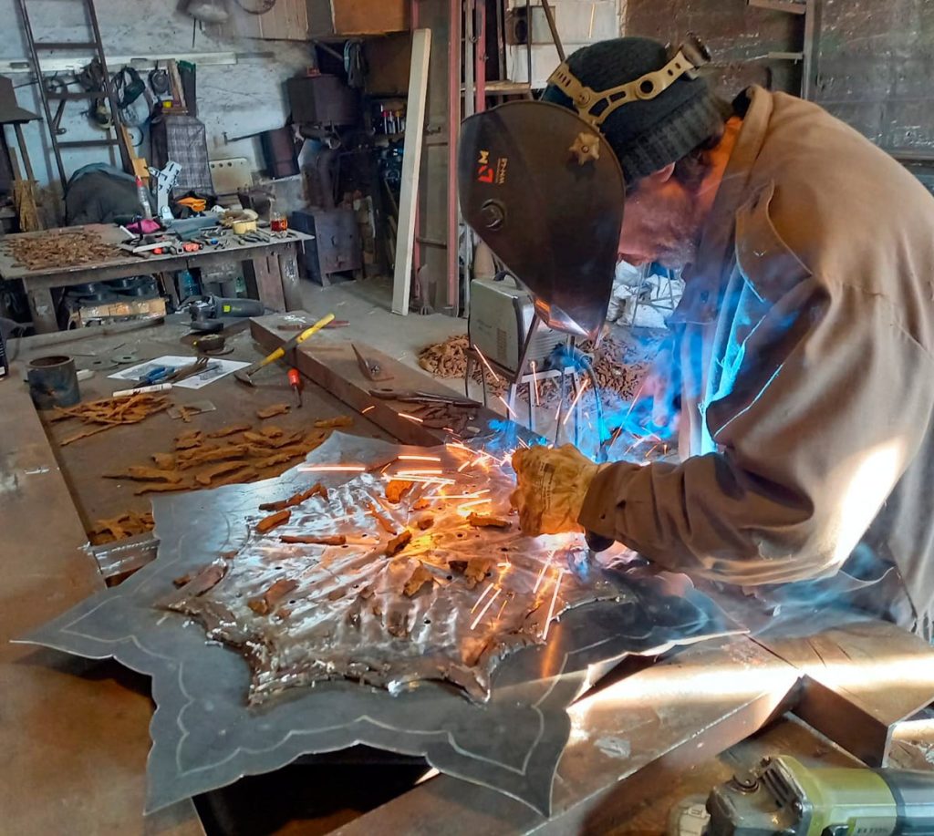 Small fragments are assembled into the desired form, each one carefully welded in place by hand.
