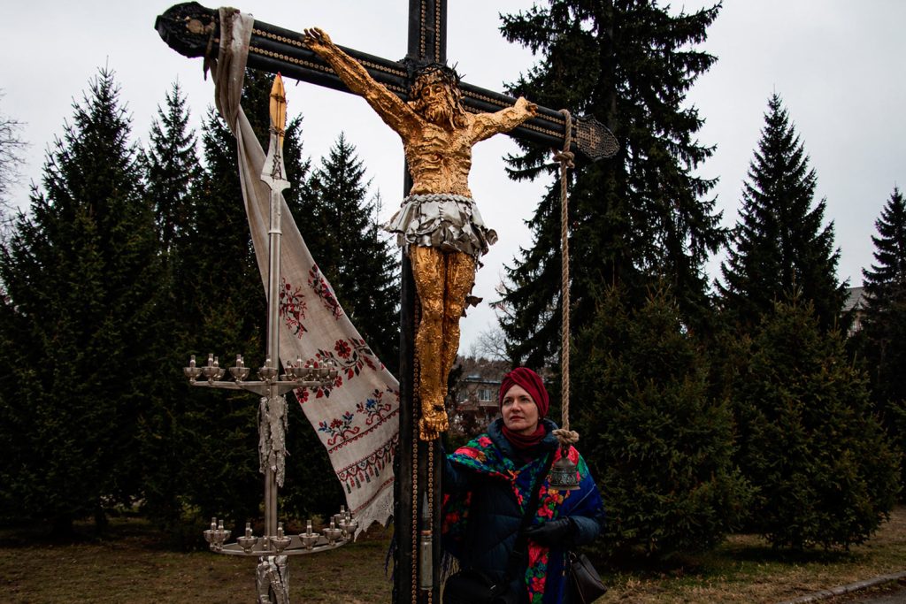 "The Cross of Peace" in a small village in the Ukrainian countryside. Photograph by Mariia Universaliuk (self-portrait).