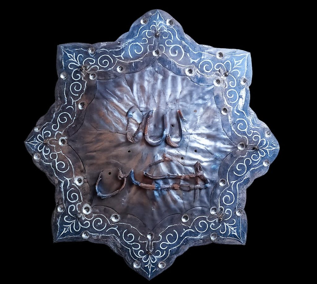 An intricate ornamental pattern will be created along the outlined lines using fragments of 5.45-calibre cartridge casings.